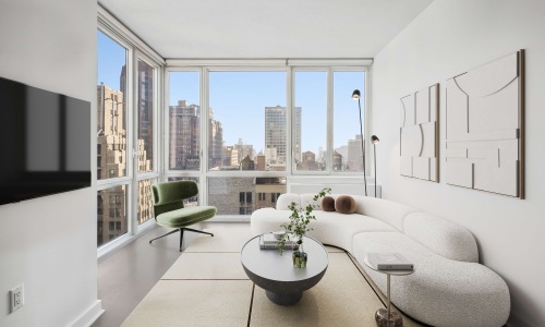 living room surrounded with large windows