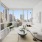 living room surrounded with large windows