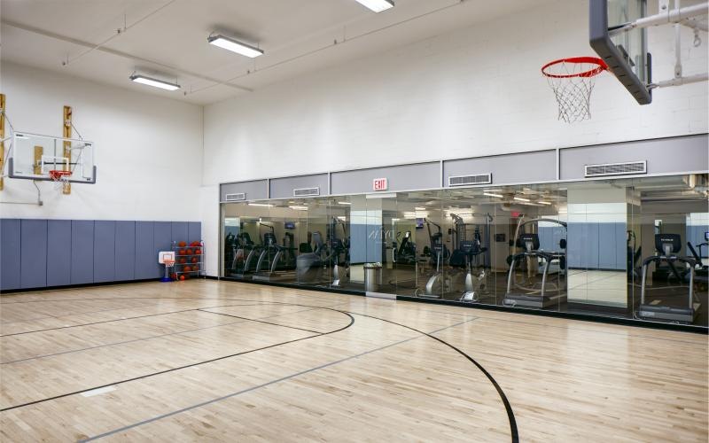 basketball court adjacent to fitness center