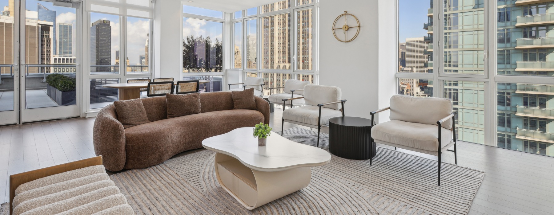 Furnished rooftop lounge with endless city views