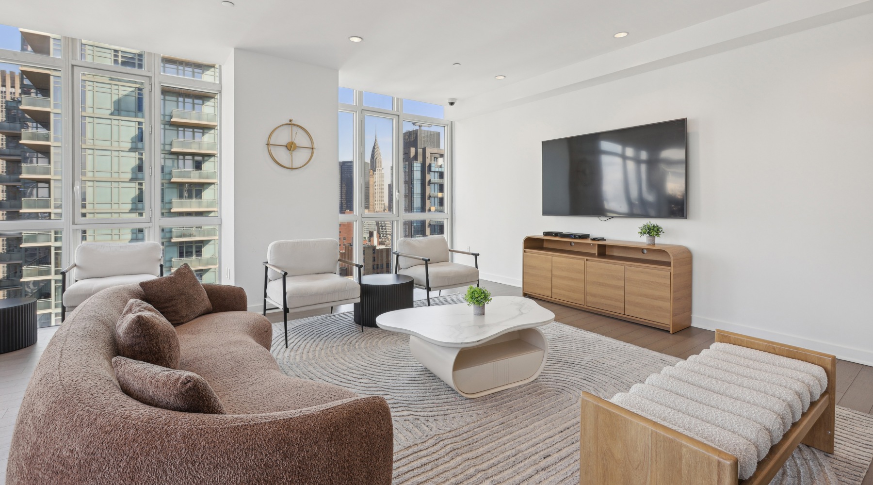 Embrace Luxury Living in Manhattan Furnished rooftop lounge with Chrysler Building views
