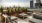 rooftop terrace with tables, chairs and planters